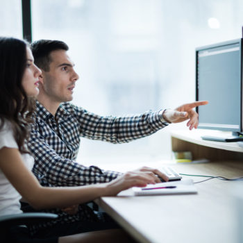 man and woman at computer